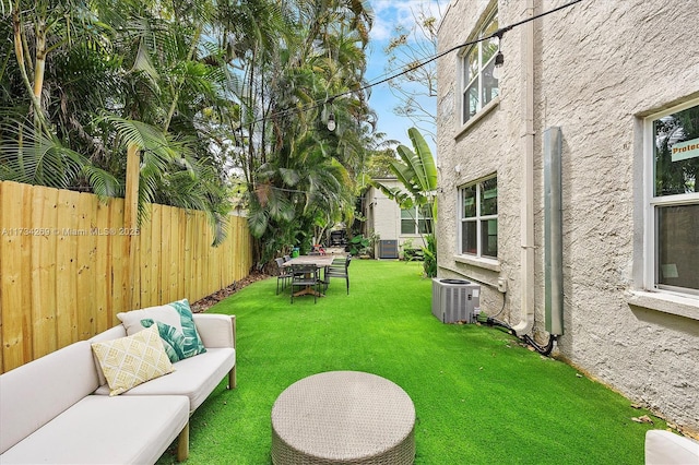 view of yard featuring cooling unit and an outdoor living space