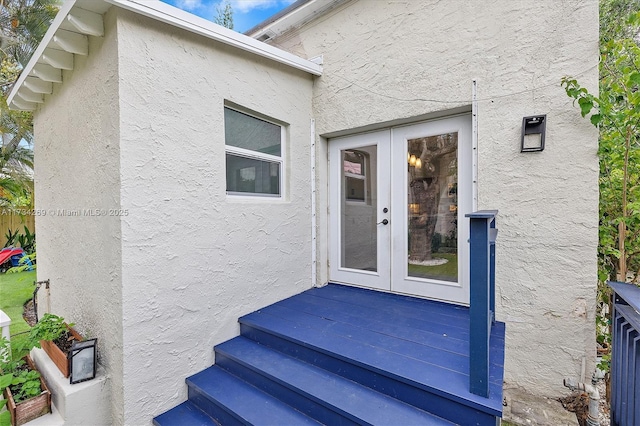 entrance to property featuring french doors