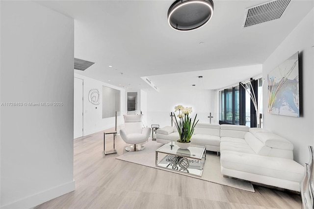 living room with light hardwood / wood-style flooring