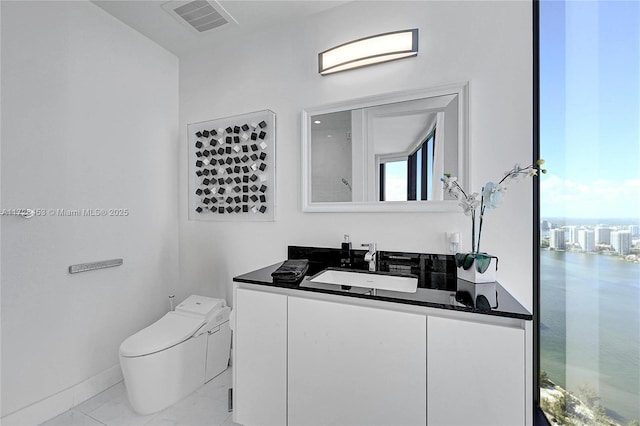 bathroom with vanity and toilet