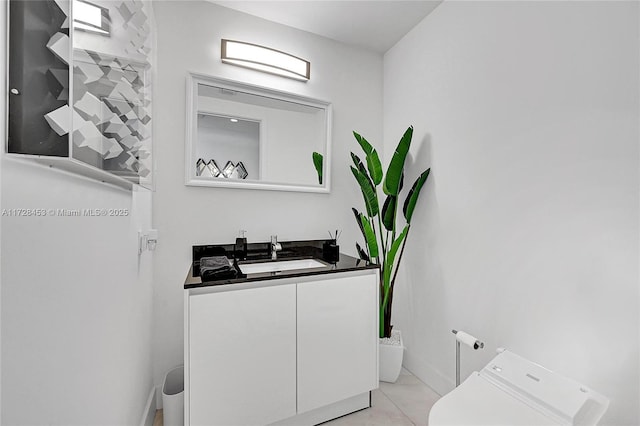 washroom with sink and cabinets