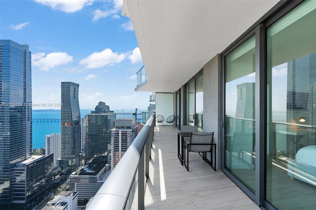 balcony featuring a water view