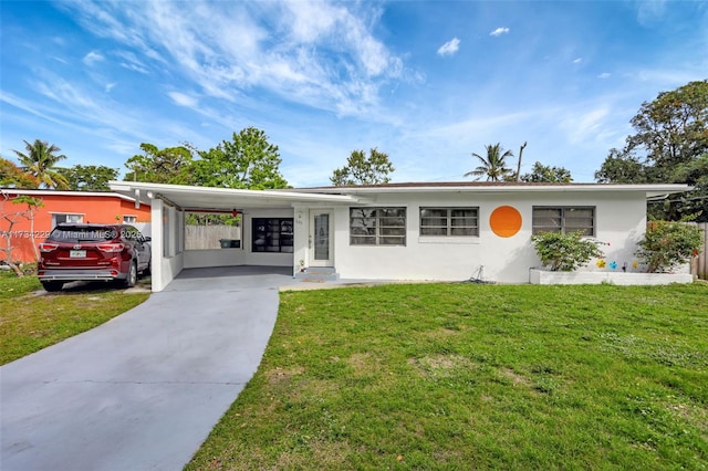 single story home with a carport and a front lawn