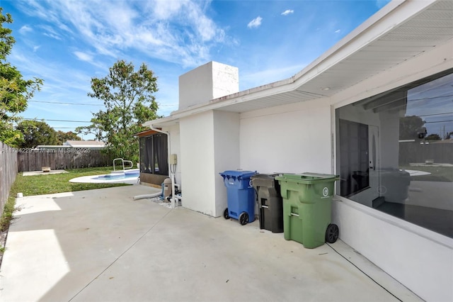 view of patio featuring a fenced in pool