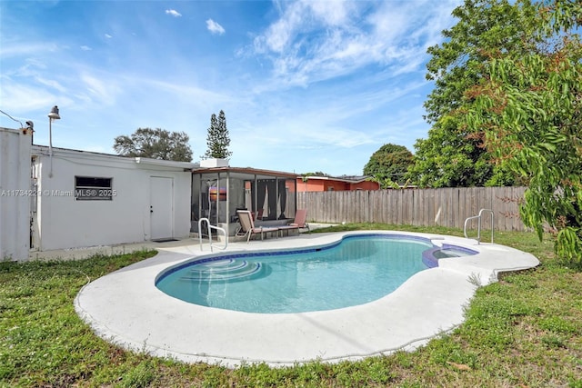 view of pool featuring a sunroom and a patio