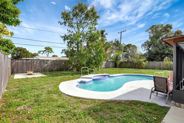 view of swimming pool with an in ground hot tub, a yard, and a patio area