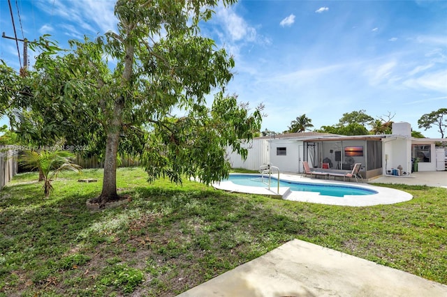 view of pool featuring a yard and a patio area