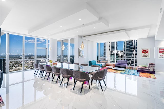 dining space featuring floor to ceiling windows