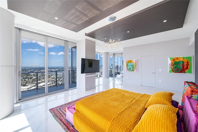 bedroom with a wall of windows, a raised ceiling, multiple windows, and access to outside