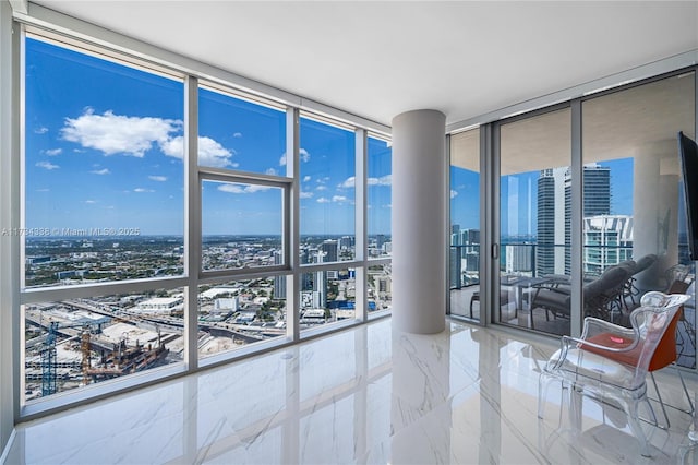 unfurnished room with expansive windows