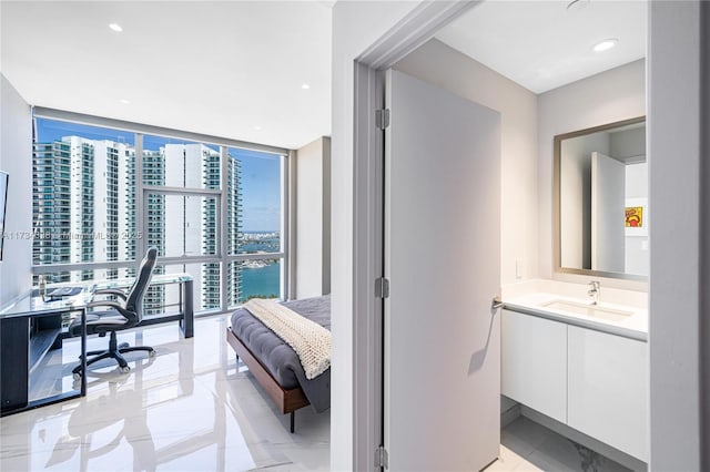 interior space featuring sink and floor to ceiling windows