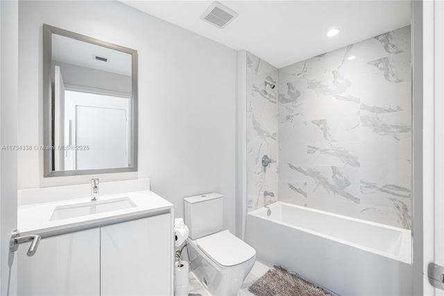 full bathroom featuring tiled shower / bath combo, vanity, and toilet