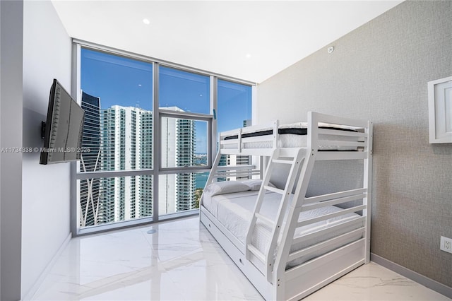 bedroom featuring a wall of windows