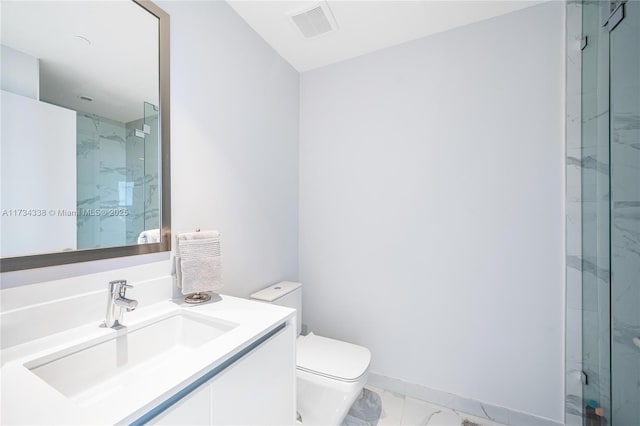 bathroom featuring vanity, toilet, and walk in shower