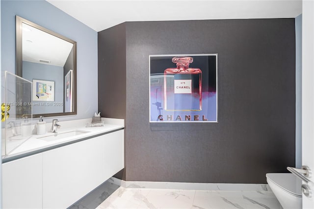 bathroom with vanity and toilet