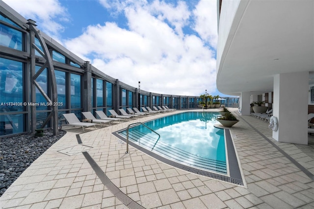 view of swimming pool with a patio area