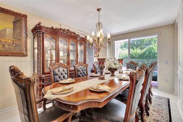 dining room with an inviting chandelier and light tile patterned floors