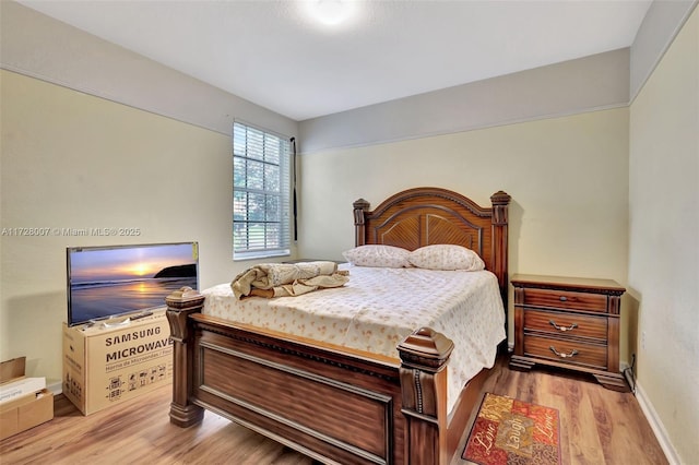 bedroom with light wood-type flooring