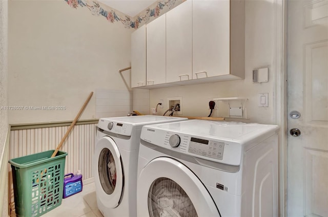 laundry room with cabinets and washer and dryer