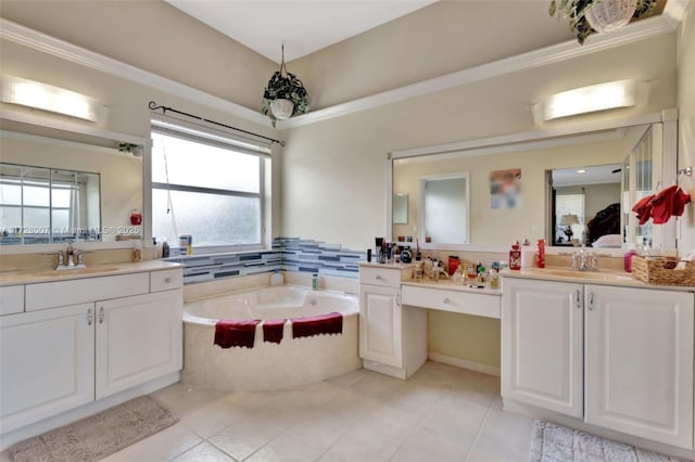 bathroom featuring vanity, tile patterned flooring, a relaxing tiled tub, and a healthy amount of sunlight