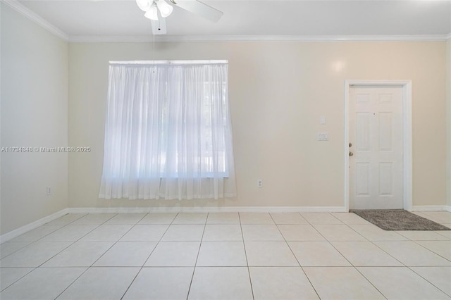 spare room with light tile patterned flooring, ceiling fan, and ornamental molding