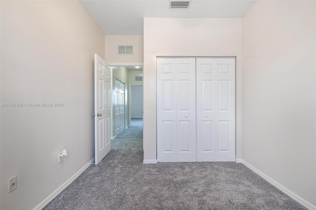 unfurnished bedroom featuring a closet and carpet