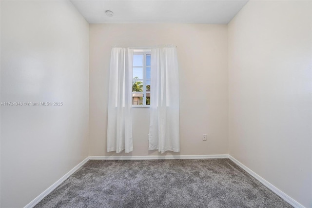 unfurnished room featuring carpet