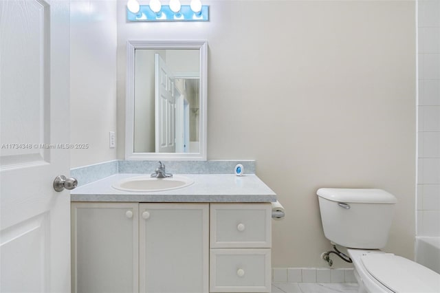 bathroom with vanity and toilet