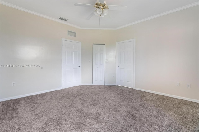 unfurnished bedroom with crown molding, ceiling fan, and carpet floors