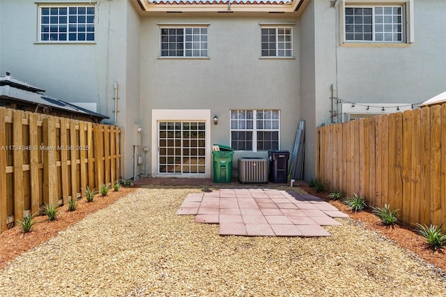 rear view of property featuring a patio