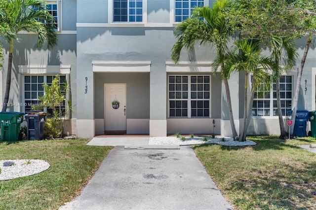 entrance to property with a yard