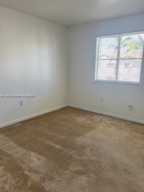 empty room with carpet flooring