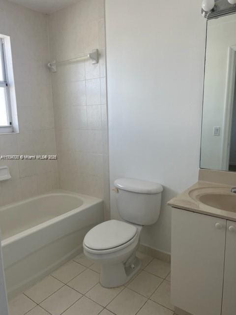 full bathroom featuring tiled shower / bath combo, tile patterned flooring, vanity, and toilet