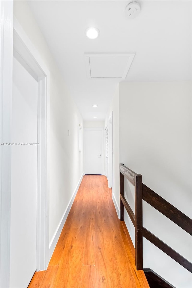 hall with wood-type flooring