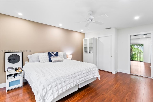 bedroom with ceiling fan and wood-type flooring