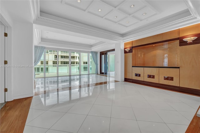 empty room featuring tile patterned flooring, crown molding, and coffered ceiling