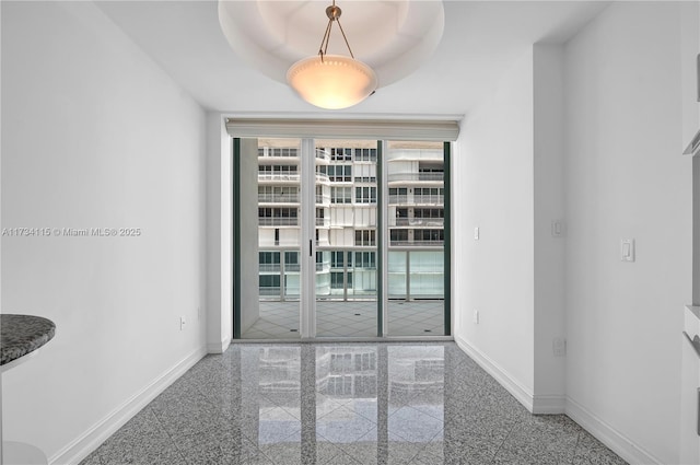 empty room featuring a tray ceiling