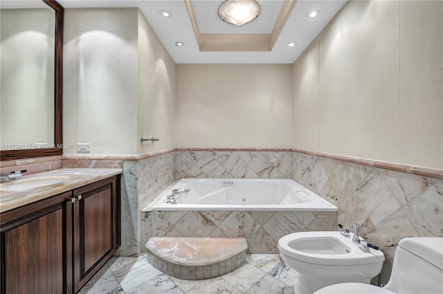 bathroom featuring a bidet, tile walls, a relaxing tiled tub, a raised ceiling, and toilet