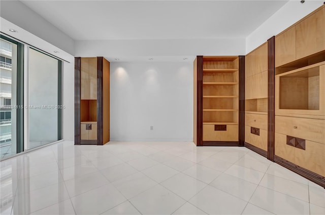 unfurnished room featuring light tile patterned flooring