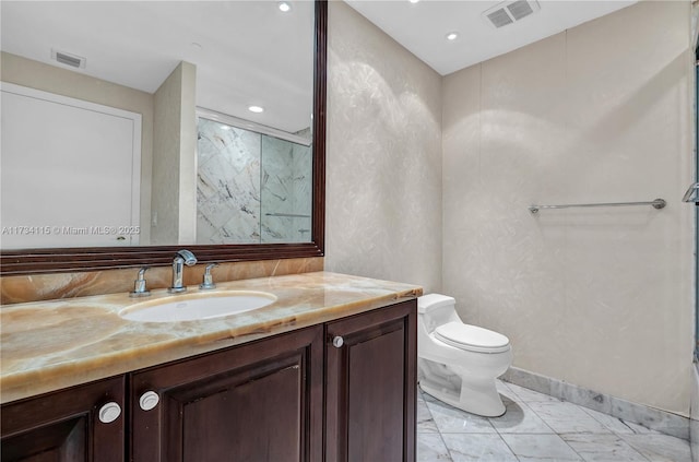 bathroom featuring vanity, a shower, and toilet