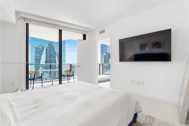 bedroom featuring floor to ceiling windows and access to outside