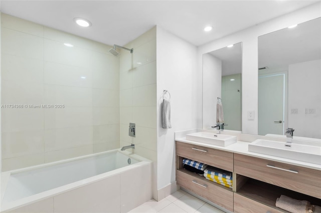 bathroom featuring vanity, tiled shower / bath combo, and tile patterned floors