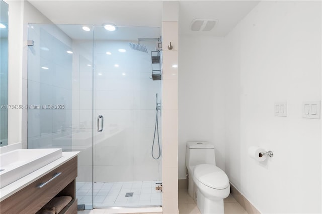 bathroom with vanity, an enclosed shower, and toilet