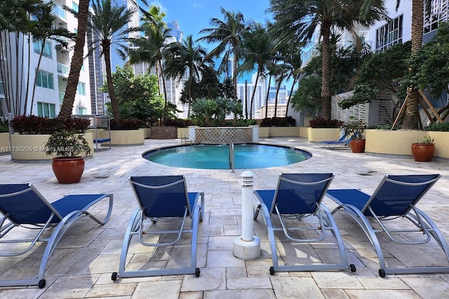 view of swimming pool featuring a patio area