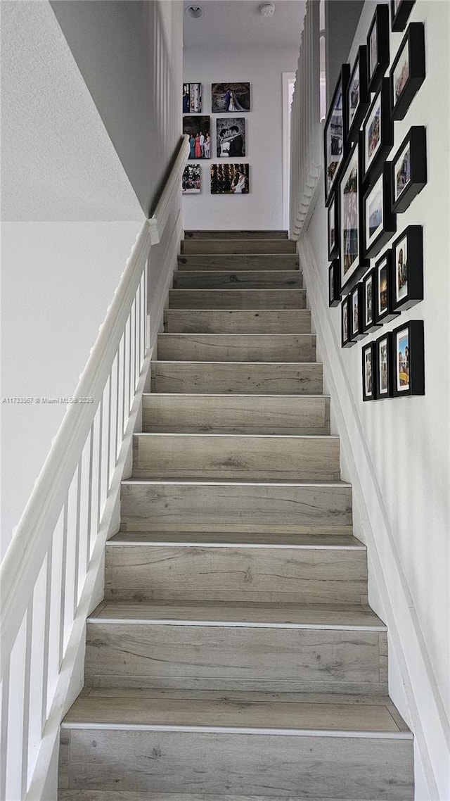 stairs with wood finished floors