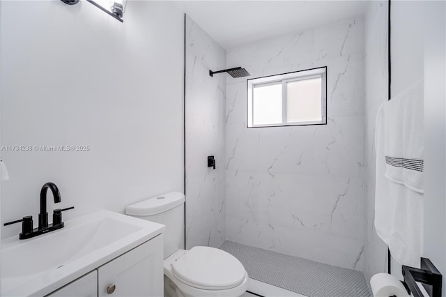 bathroom featuring vanity, toilet, and a marble finish shower