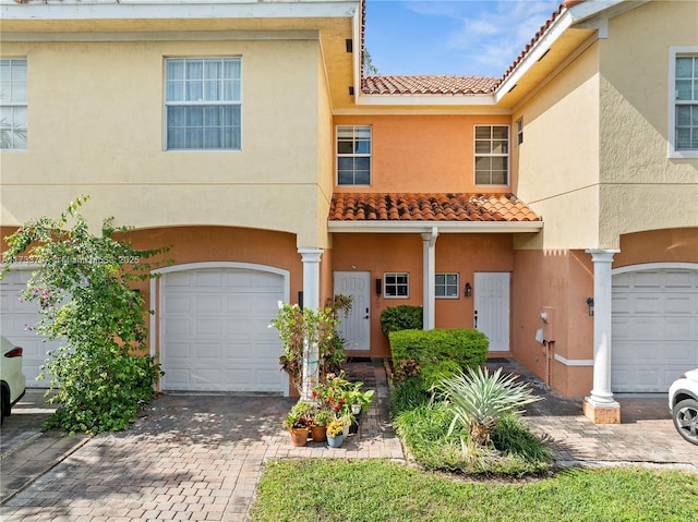 view of front of property with a garage