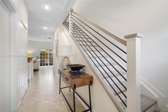 stairs featuring tile patterned floors