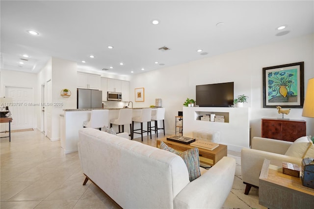 living room with light tile patterned floors