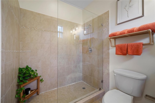 bathroom with tiled shower and toilet